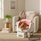 AutoScooper 12 litter box in Pink in a cosy reading nook